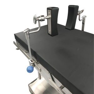 Lateral lumbar support arms and pads for surgical table